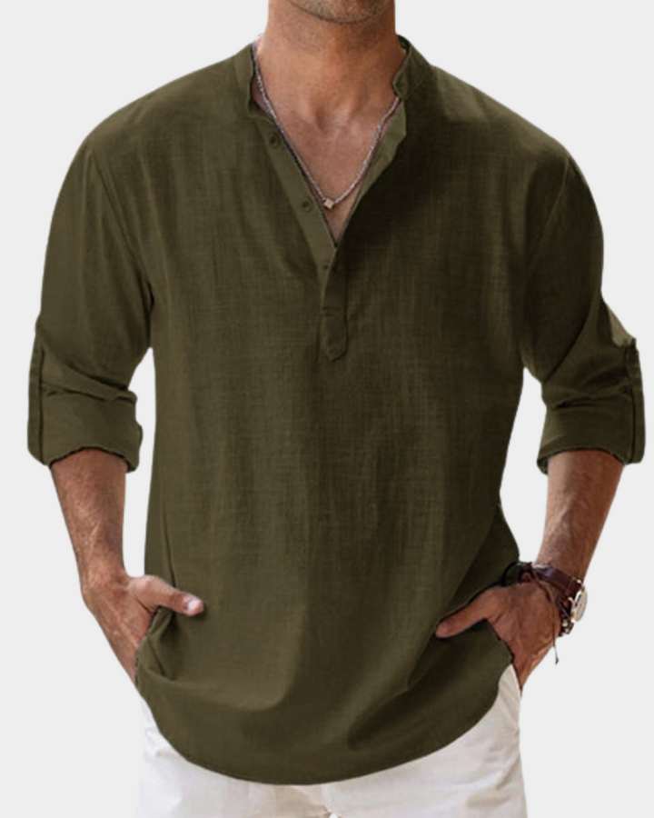 Man wearing a green shirt with rolled-up sleeves on a white background