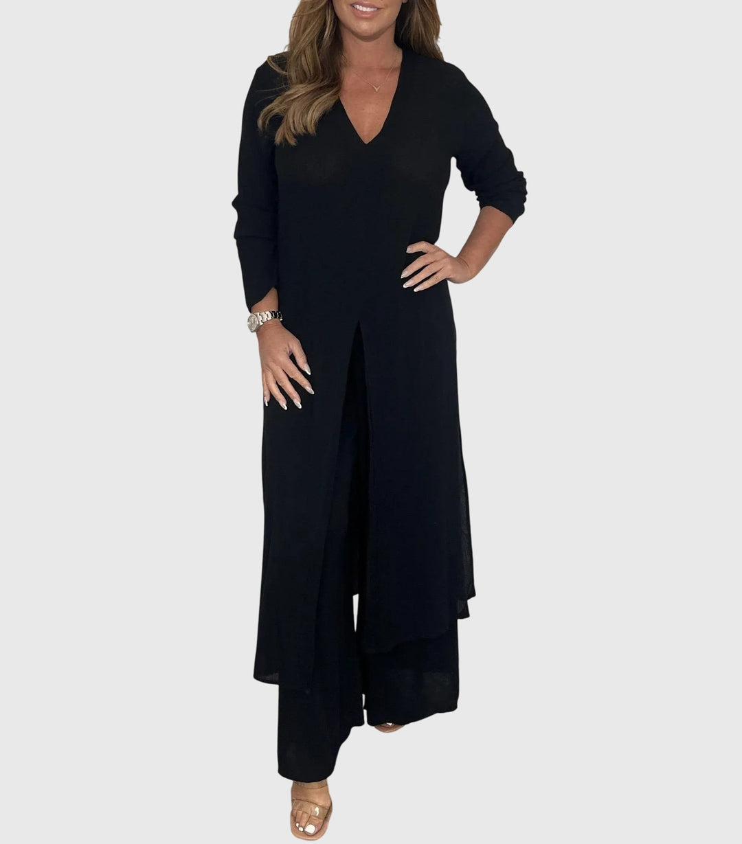 Woman wearing a black dress on a white background