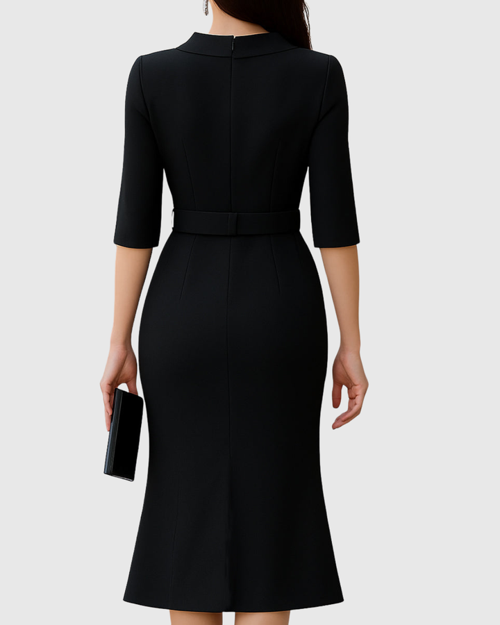 Black dress with a belt on a white background