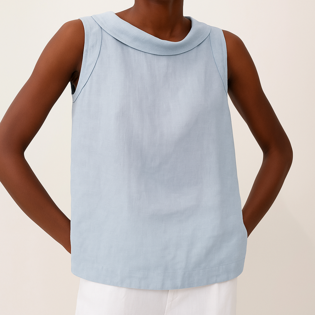 Light blue sleeveless top worn by a person on a beige background