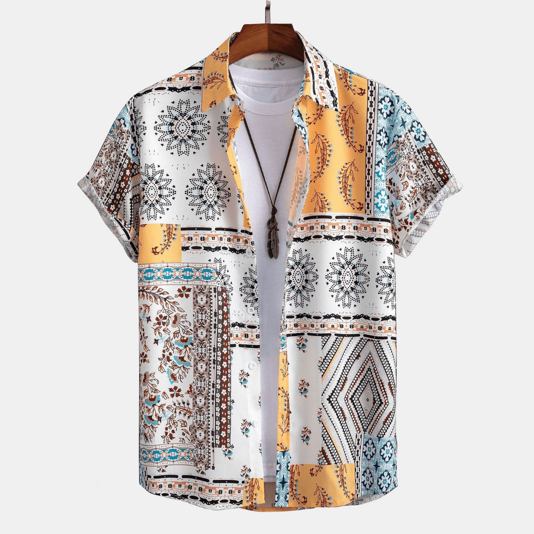 Patterned shirt on a hanger against a white background