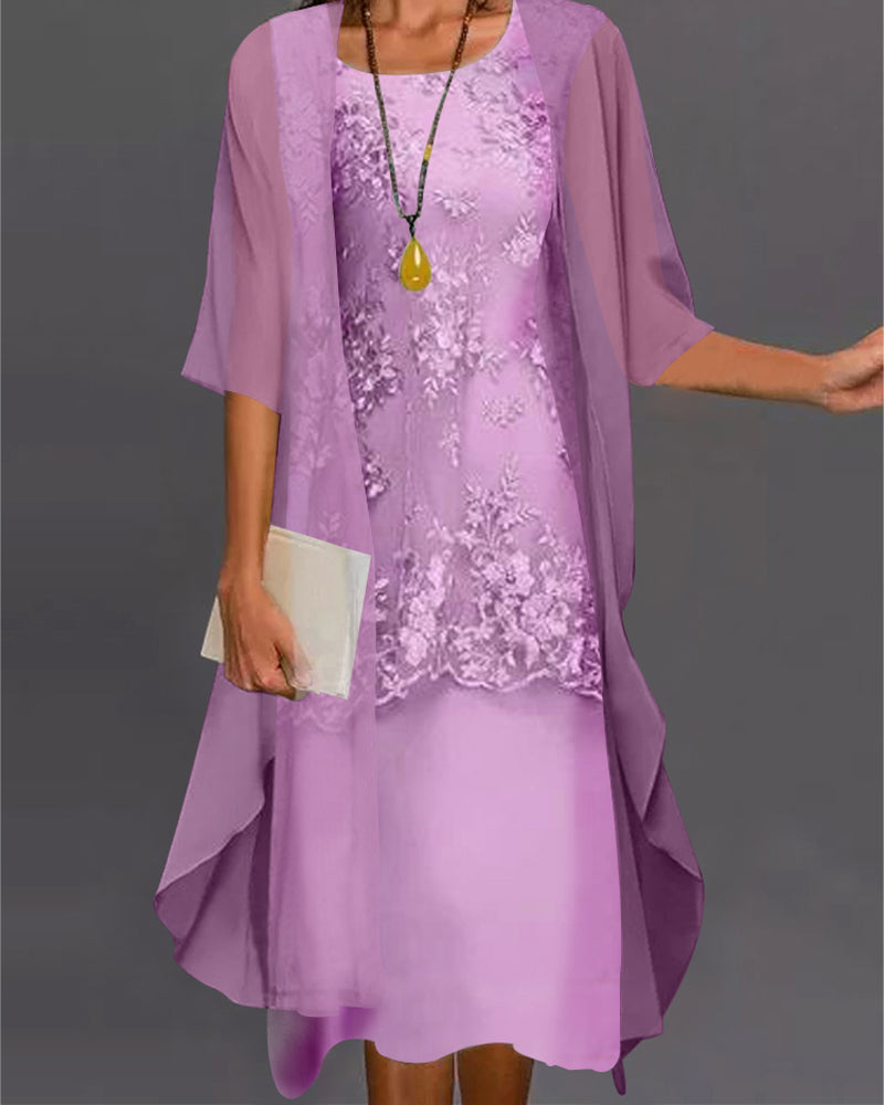 Woman wearing a purple dress with a matching jacket on a gray background