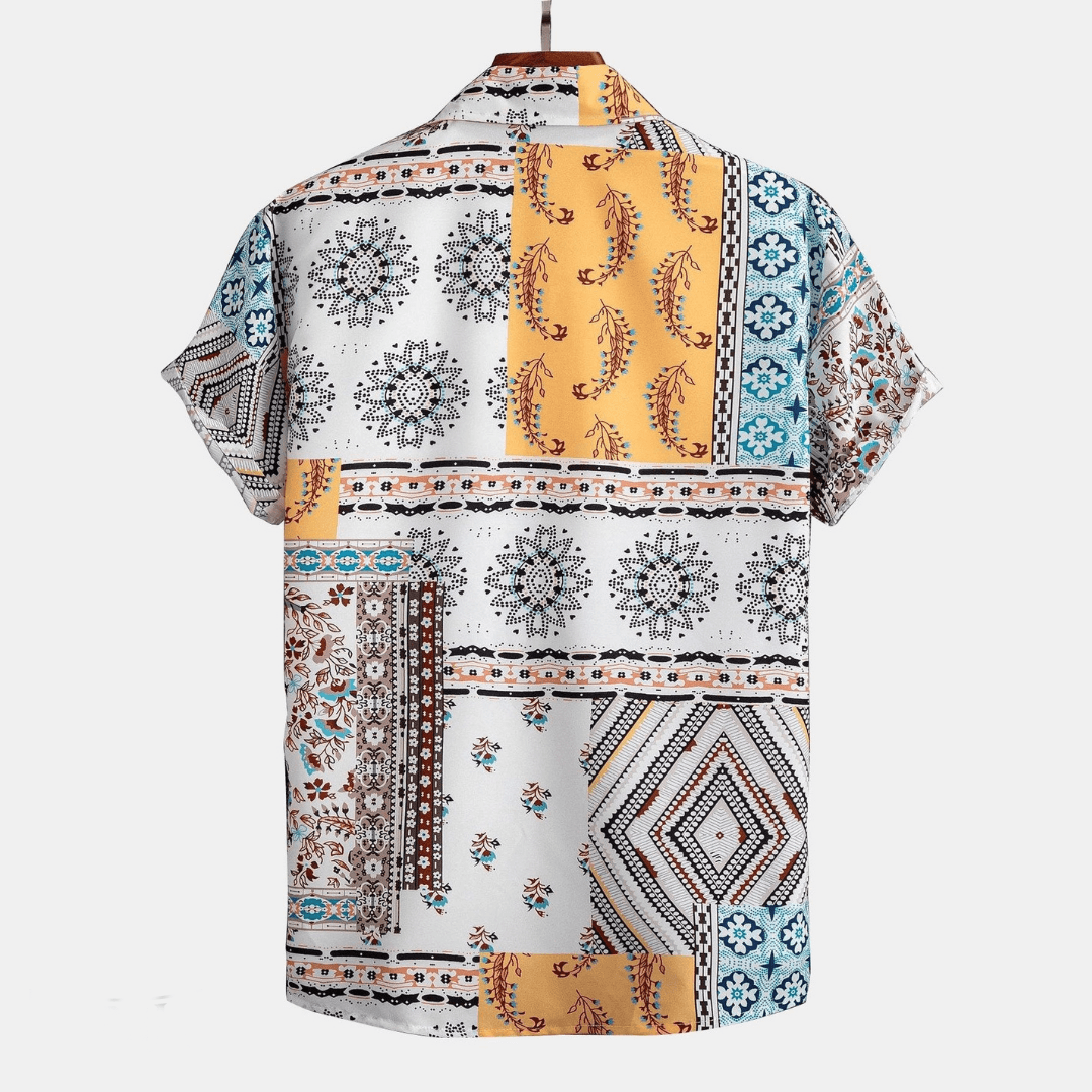Short-sleeve shirt with a colorful geometric and floral pattern on a white background