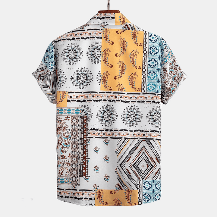 Short-sleeve shirt with a colorful geometric and floral pattern on a white background