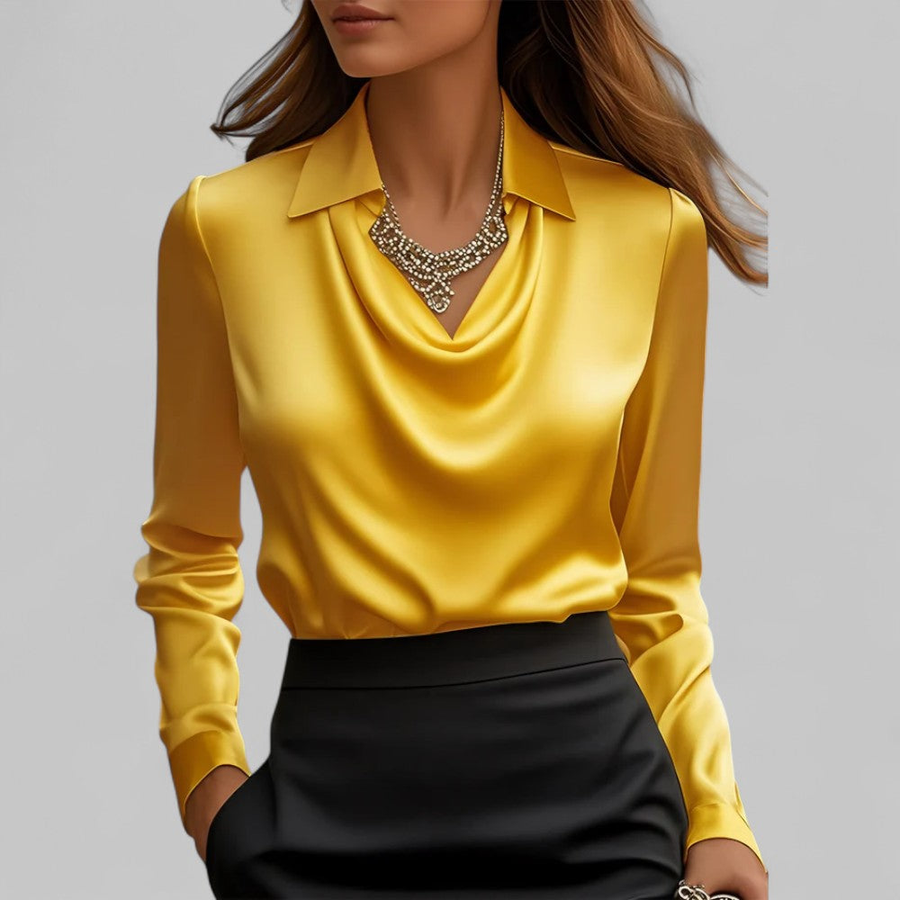 Yellow long-sleeve top worn by a person on a gray background