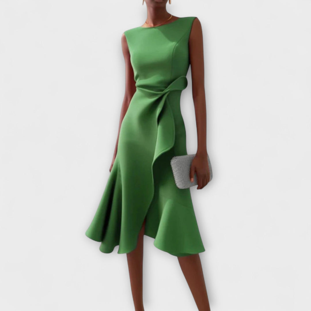Green dress worn by a model on a white background