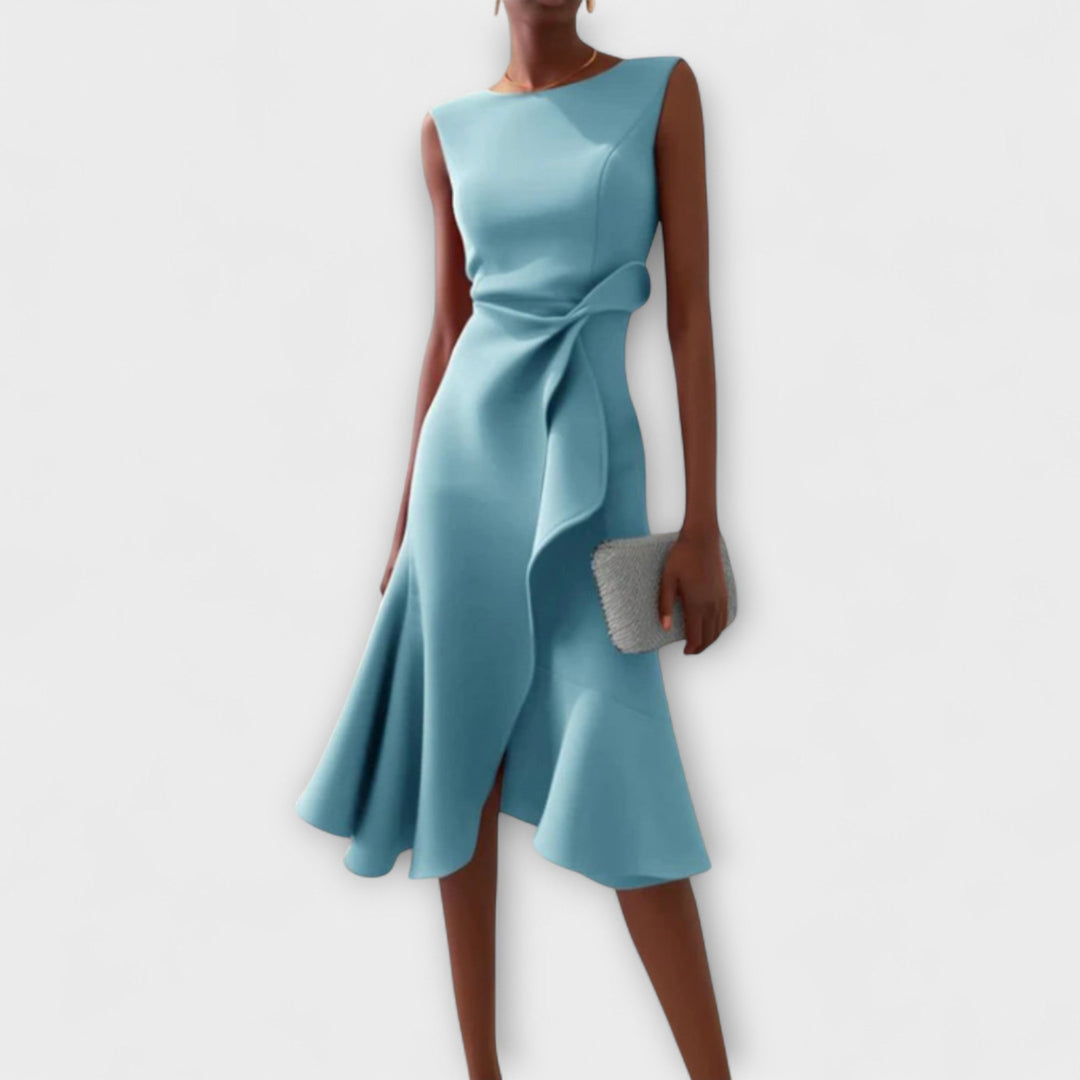 Teal dress with a bow detail on a white background