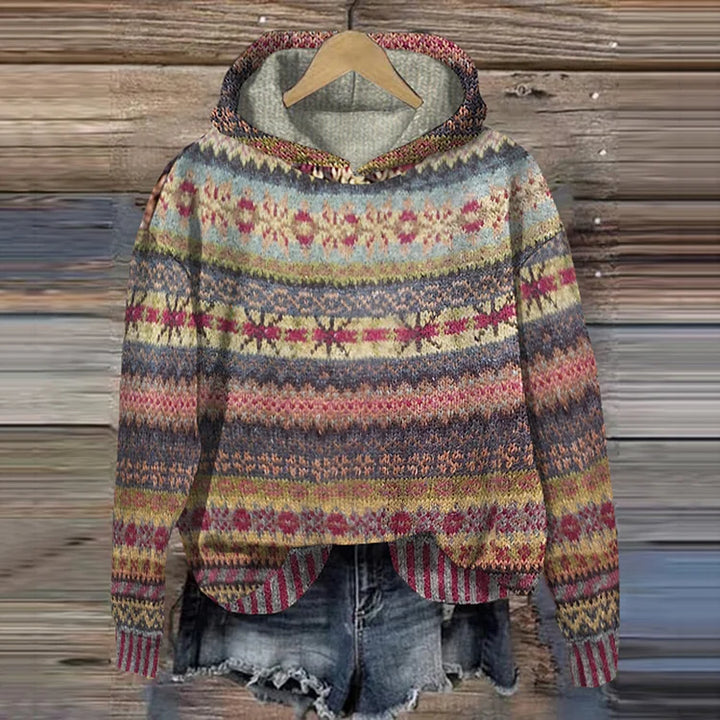 Multicolored patterned sweater on a wooden background