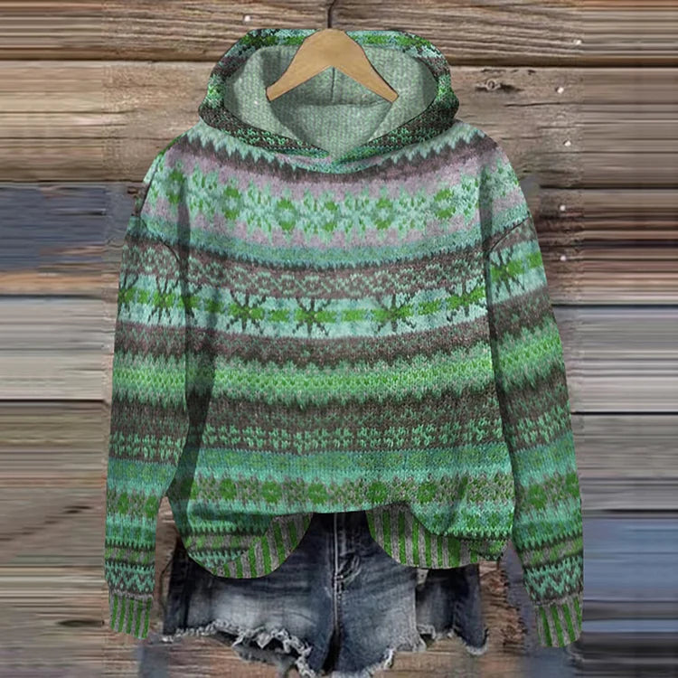 Green patterned hoodie on a wooden background