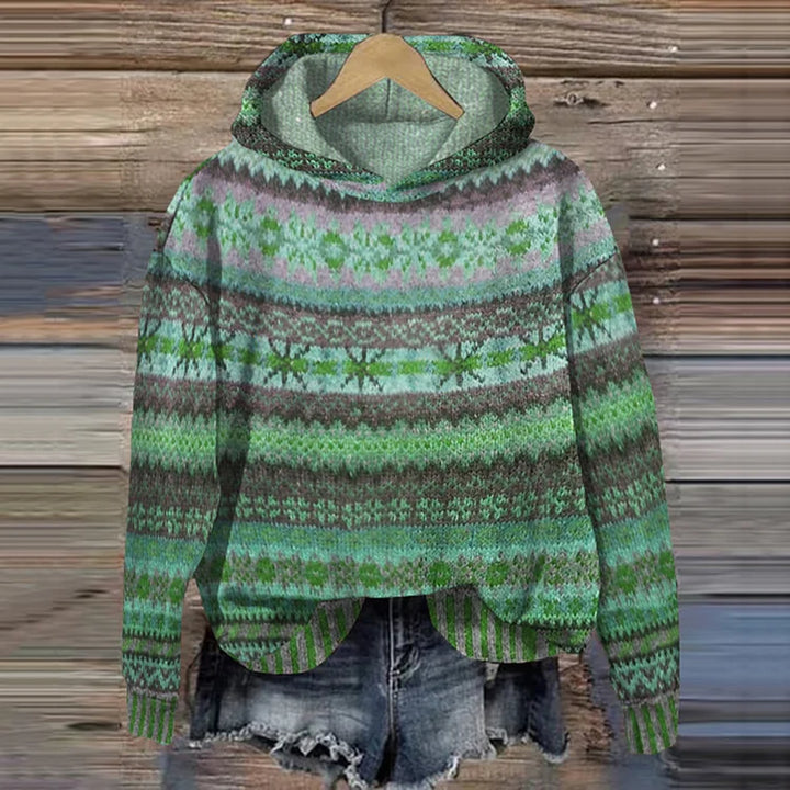 Green patterned hoodie on a wooden background