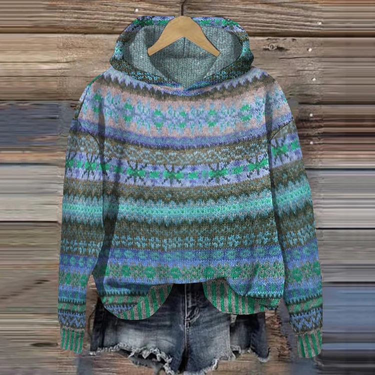 Colorful patterned sweater on a wooden background