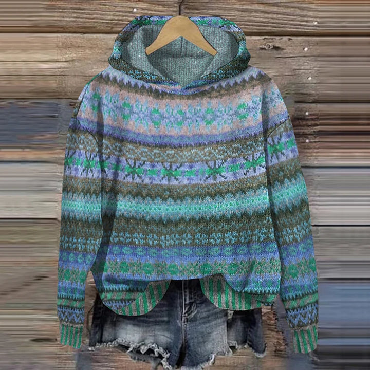 Colorful patterned sweater on a wooden background