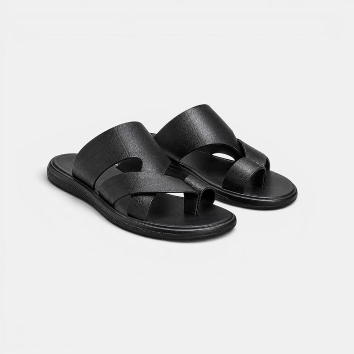 Pair of black sandals on a light gray background