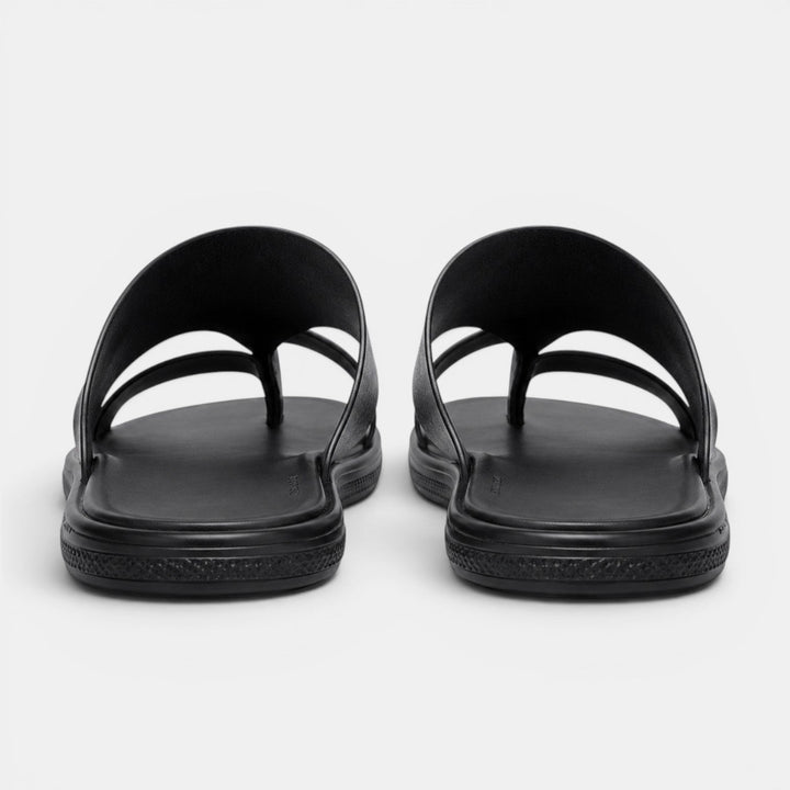 Pair of black sandals on a white background