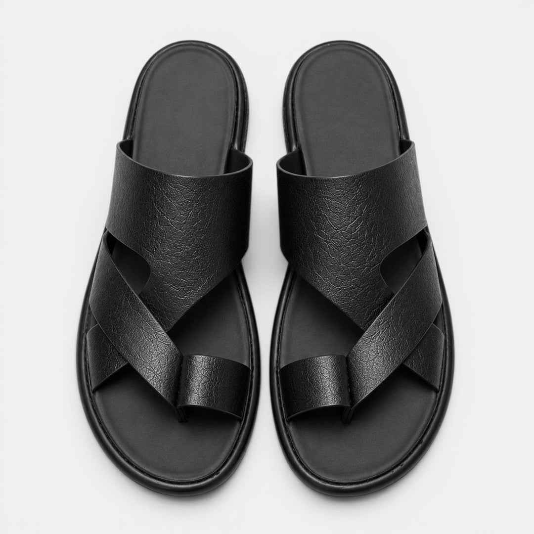 Pair of black sandals on a light gray background