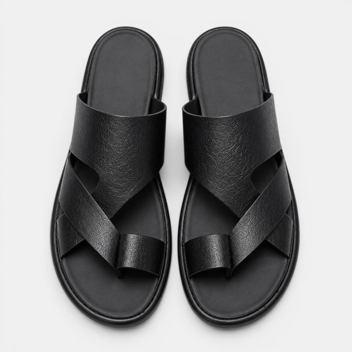 Pair of black sandals on a light gray background