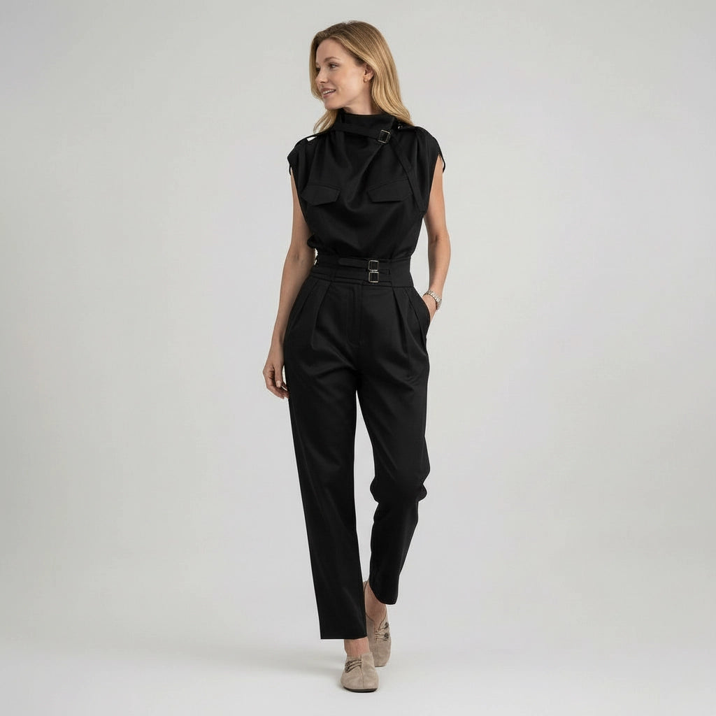 Woman wearing a black jumpsuit on a white background