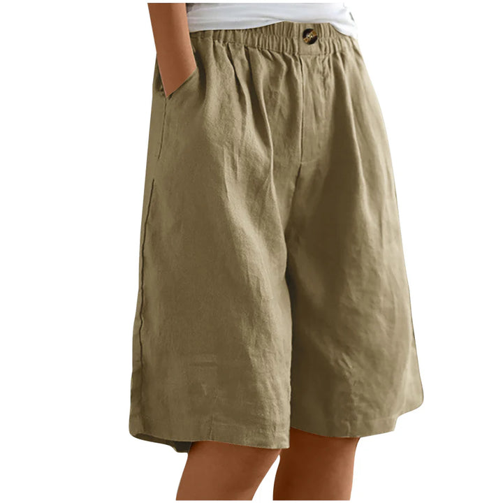 Khaki shorts worn by a person on a white background