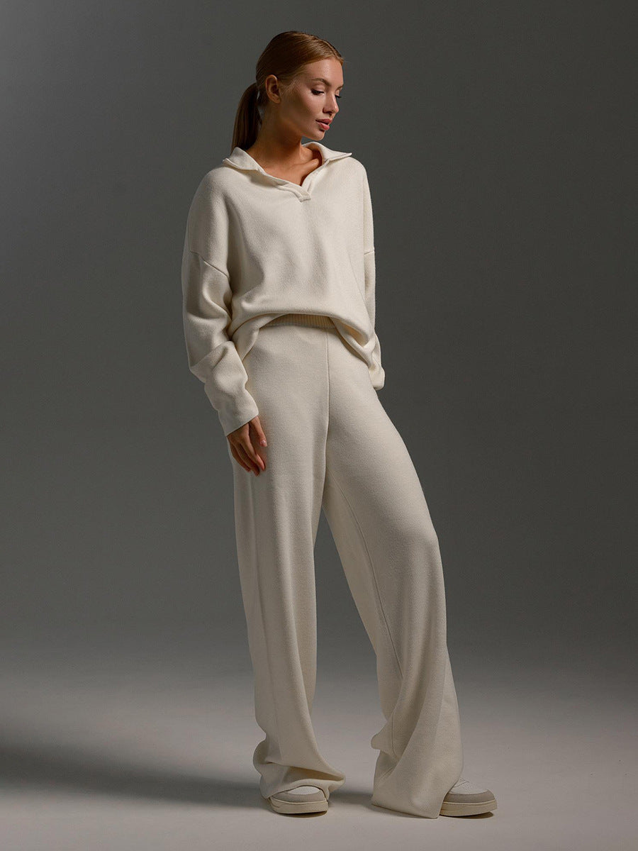 Woman wearing a white outfit against a gray background