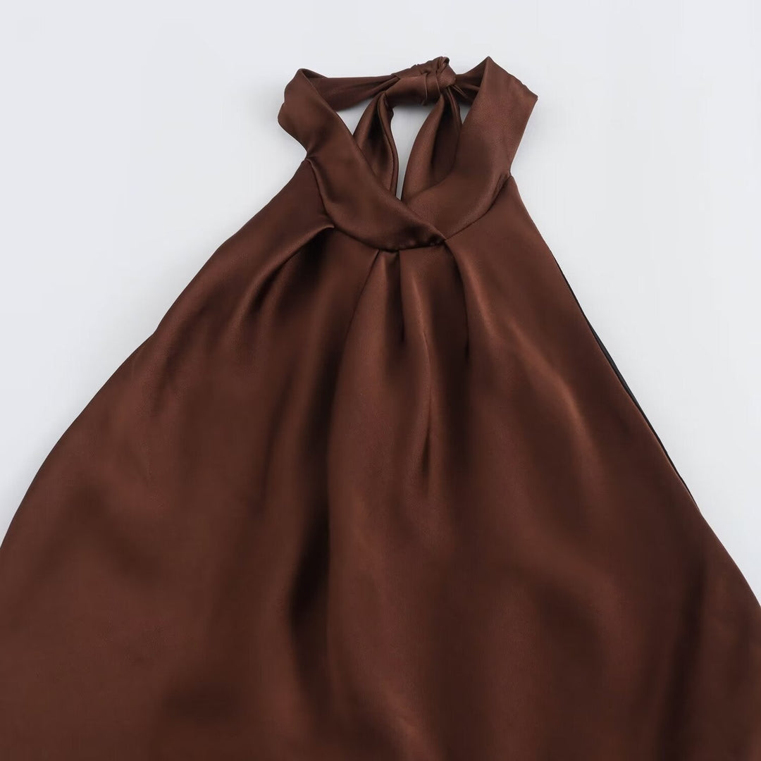Brown halter neck dress on a white background