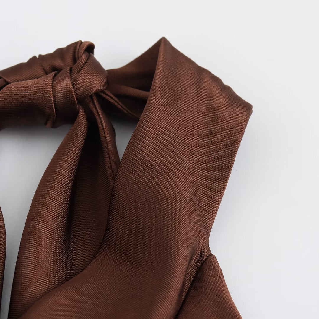 Brown fabric with a bow on a white background