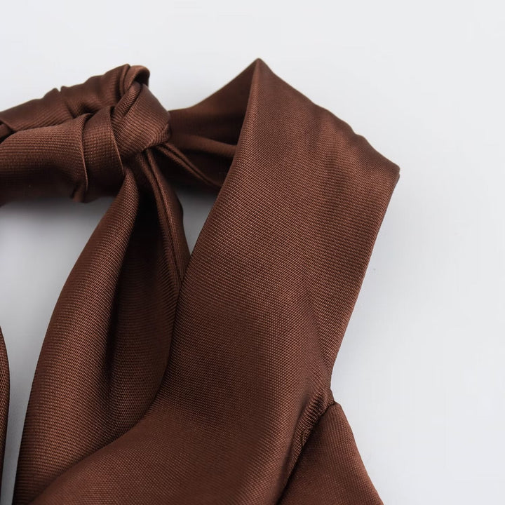 Brown fabric with a bow on a white background