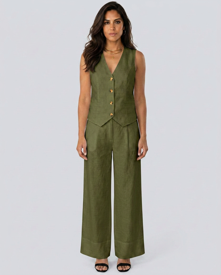 Woman wearing a green vest and wide-leg pants on a white background