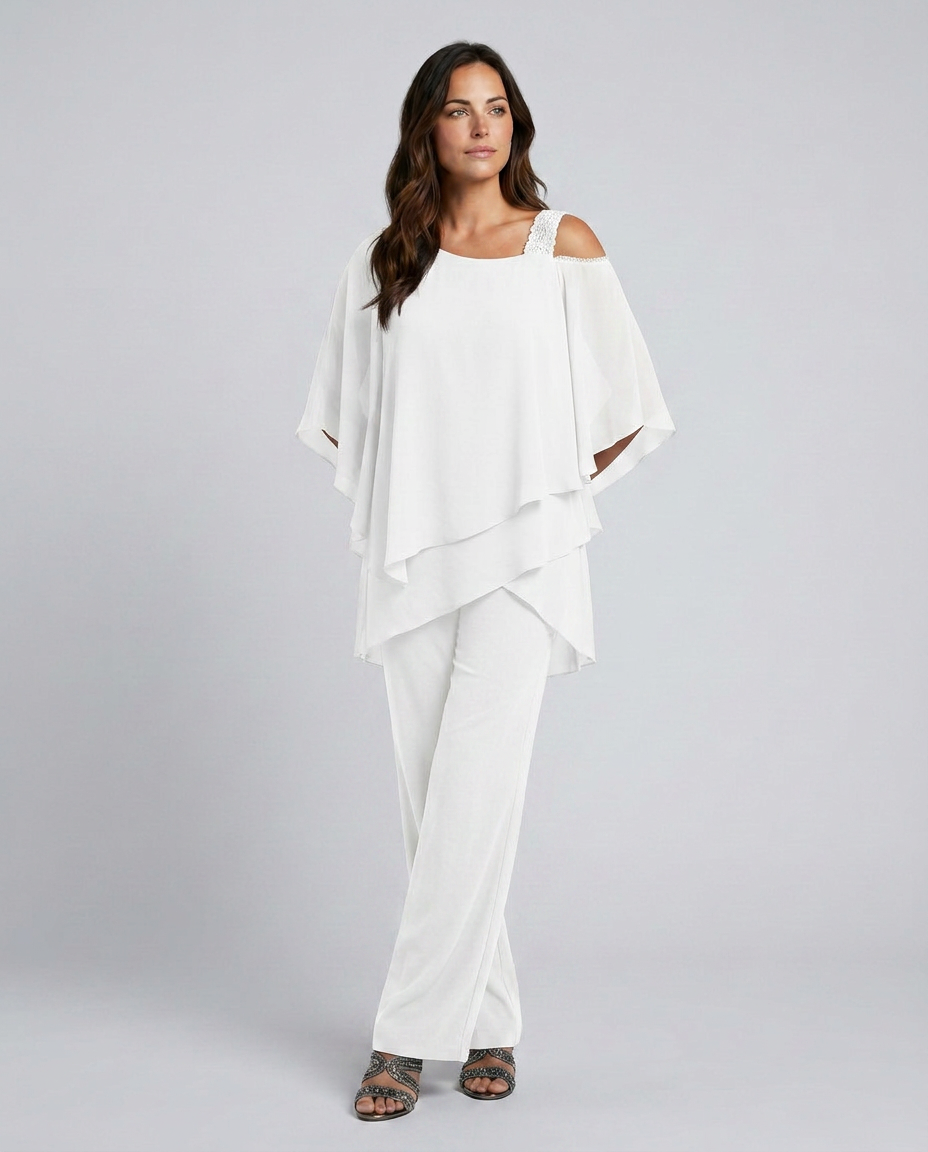 Woman wearing a white outfit on a gray background