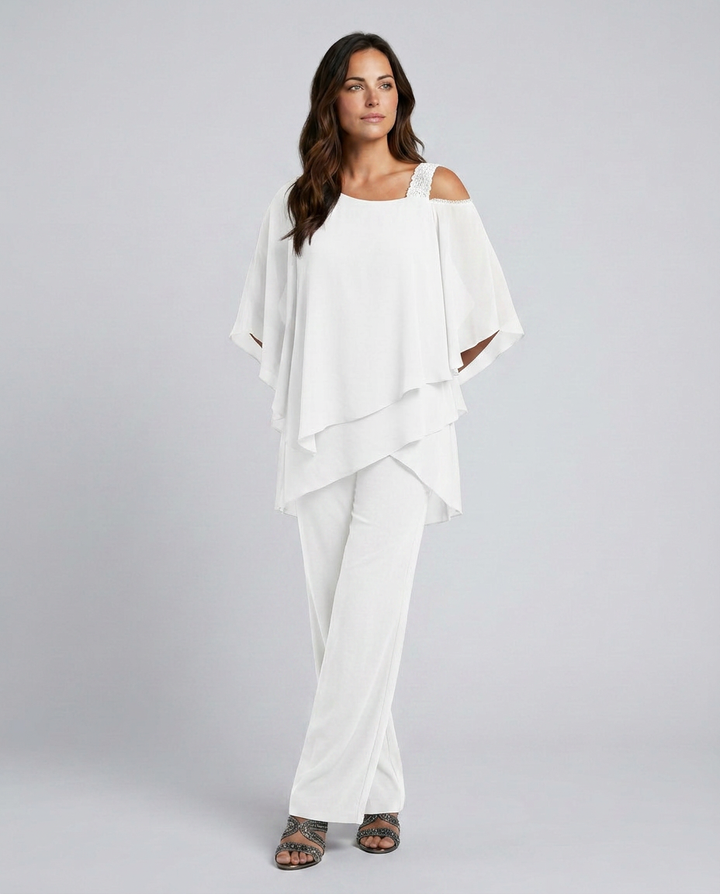 Woman wearing a white outfit on a gray background