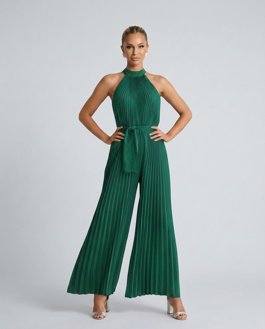 Woman wearing a green pleated jumpsuit on a white background