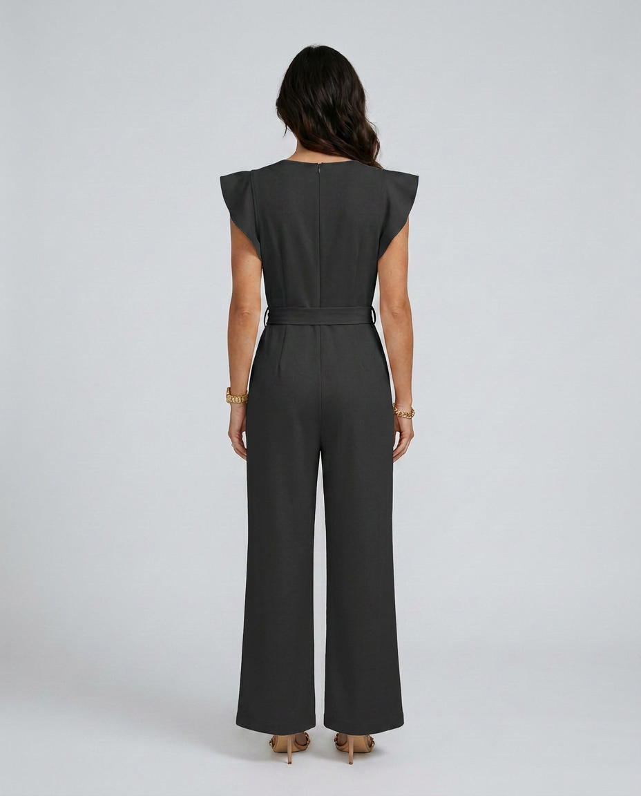 Woman wearing a black jumpsuit on a white background