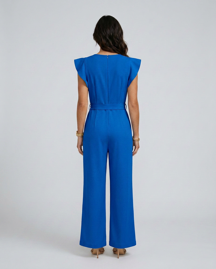 Woman wearing a blue jumpsuit on a white background