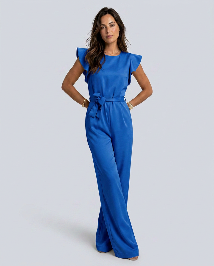 Woman wearing a blue jumpsuit on a white background
