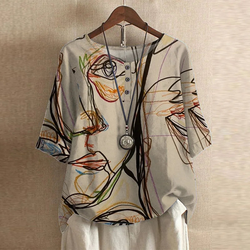 Colorful abstract patterned shirt on a hanger against a beige wall