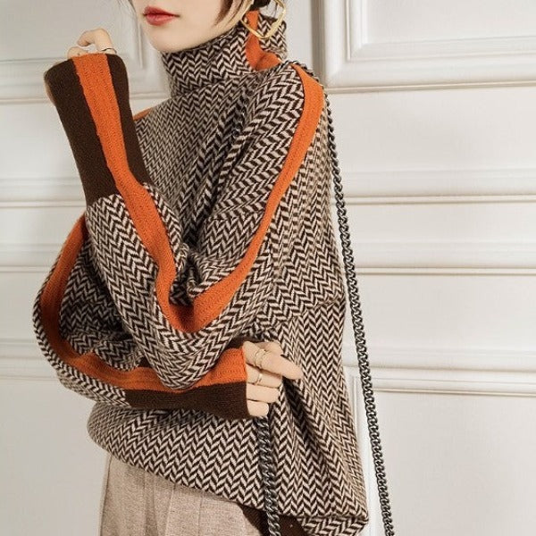 Person wearing a patterned scarf with orange and brown accents against a white background