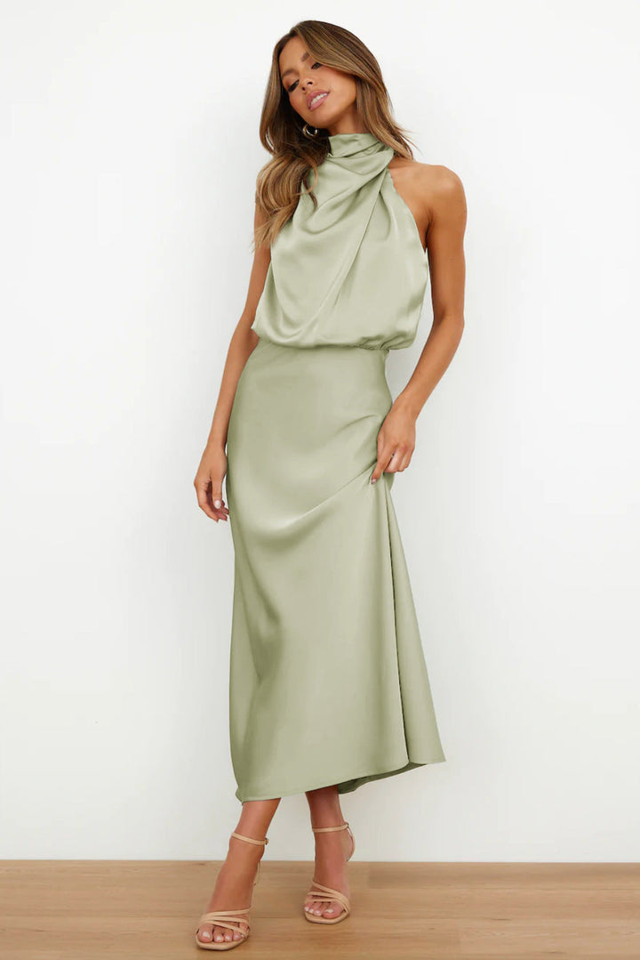 Woman wearing a green dress on a white background