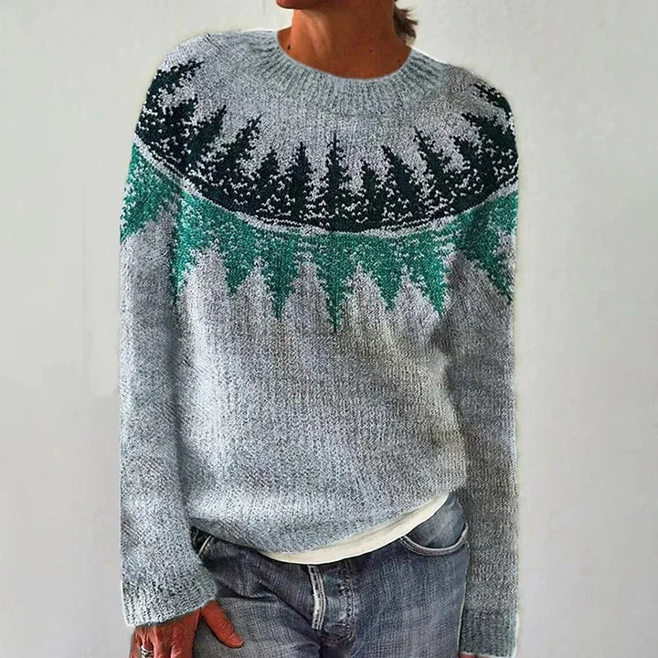 Person wearing a patterned sweater with a white background