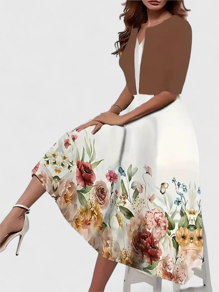 Woman wearing a floral dress with a brown top on a white background