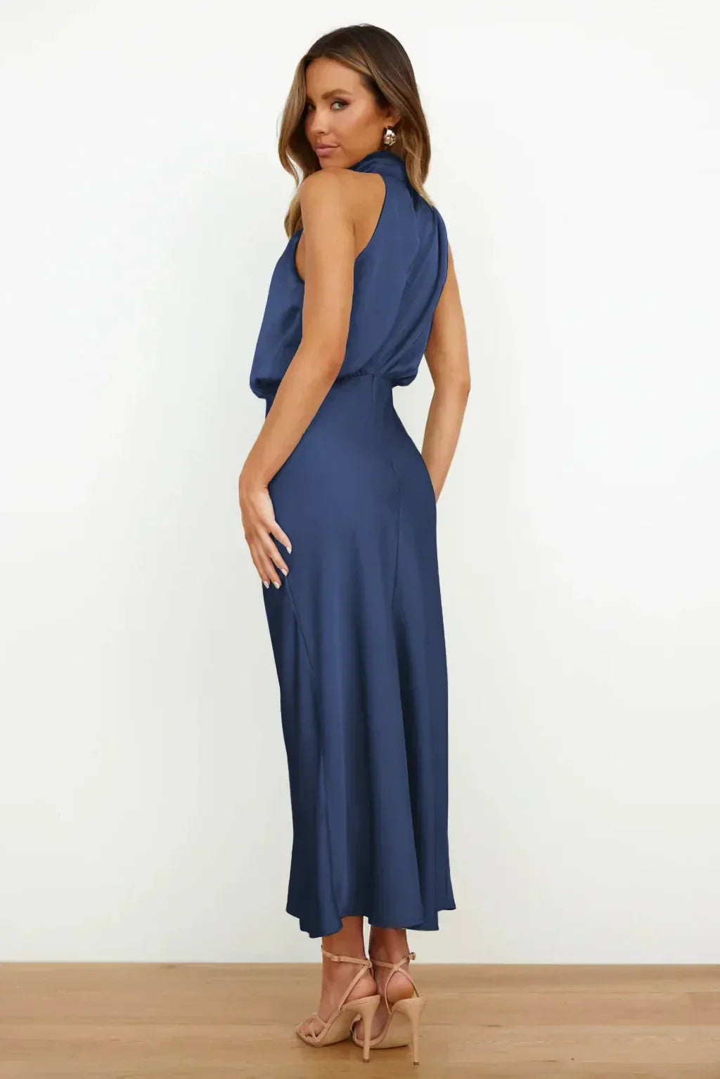 Woman wearing a blue dress on a white background