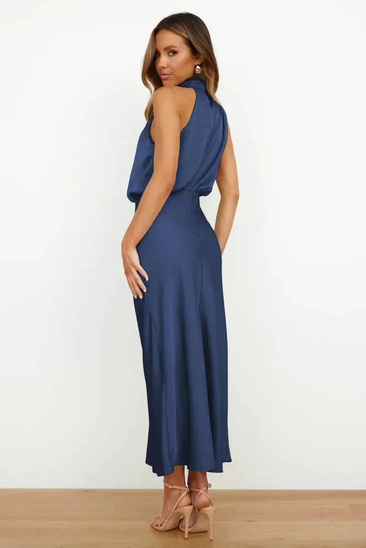 Woman wearing a blue dress on a white background