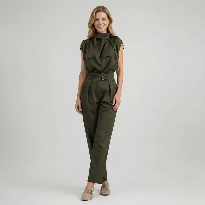 Woman wearing an olive green jumpsuit on a white background
