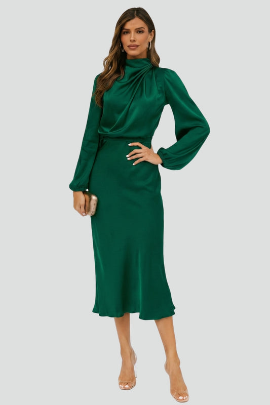 Woman wearing a green dress on a white background
