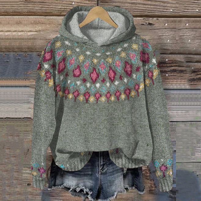 Floral patterned hoodie on a wooden background