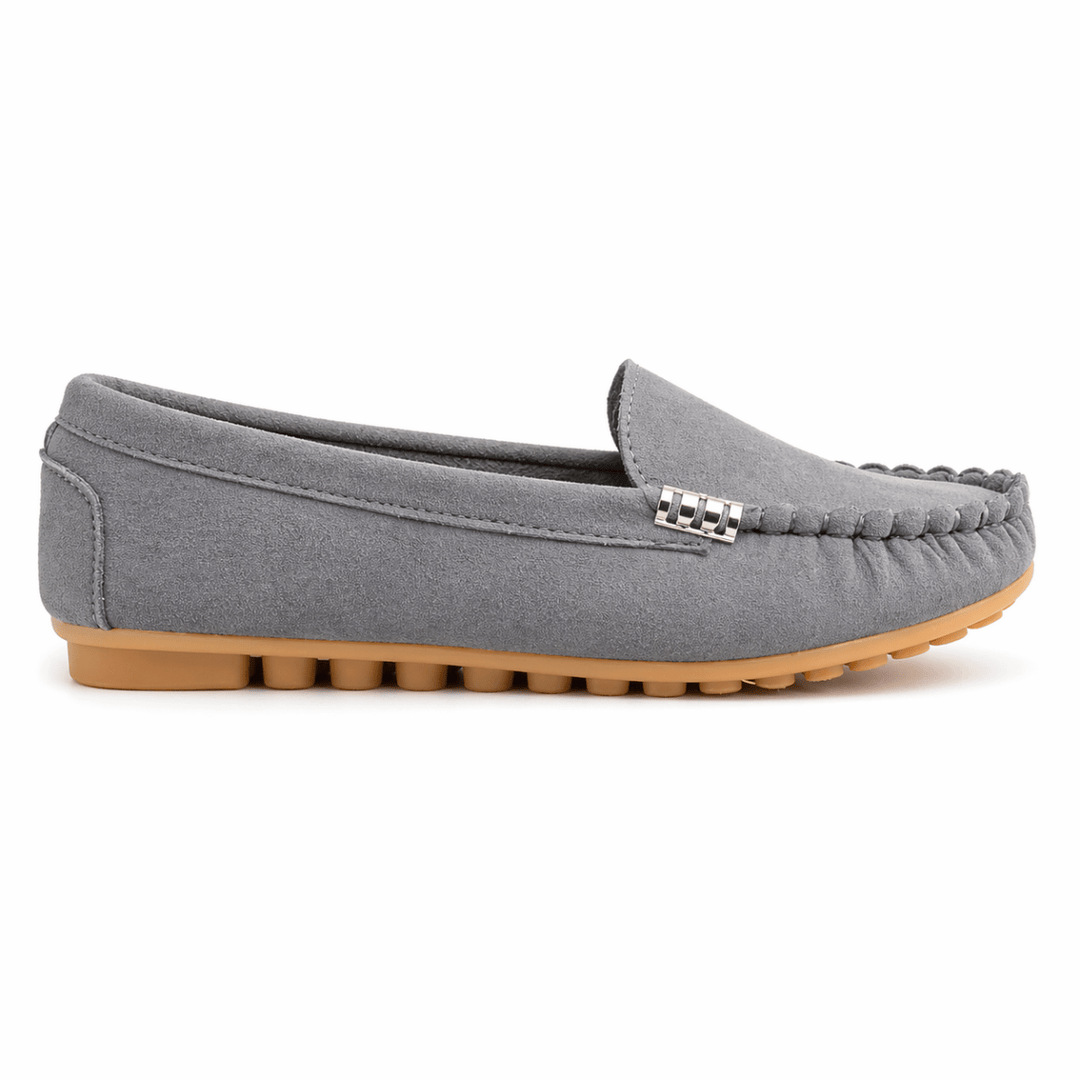Gray loafer shoe with a brown sole on a white background