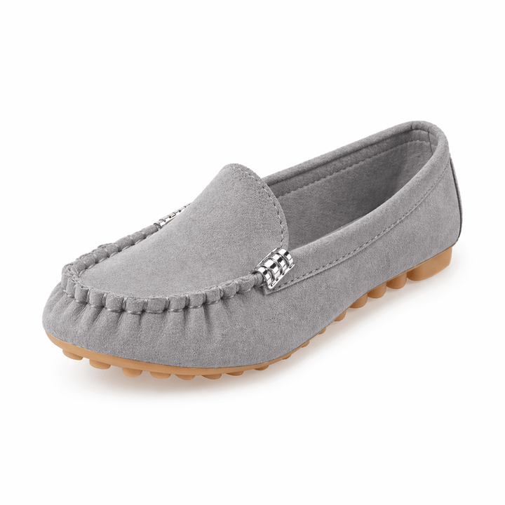 Gray loafer shoe with a decorative buckle on a white background