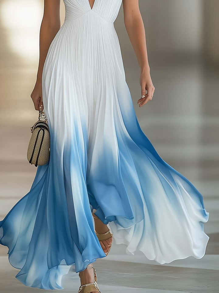Woman wearing a white and blue gradient dress with a blurred background