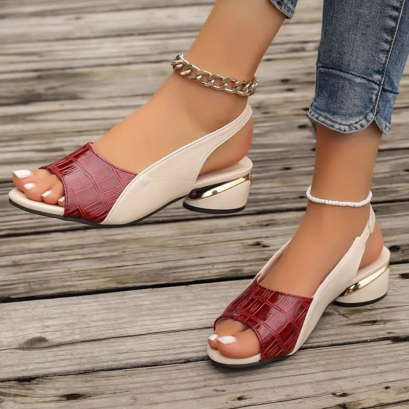 Red and beige sandals on a wooden floor