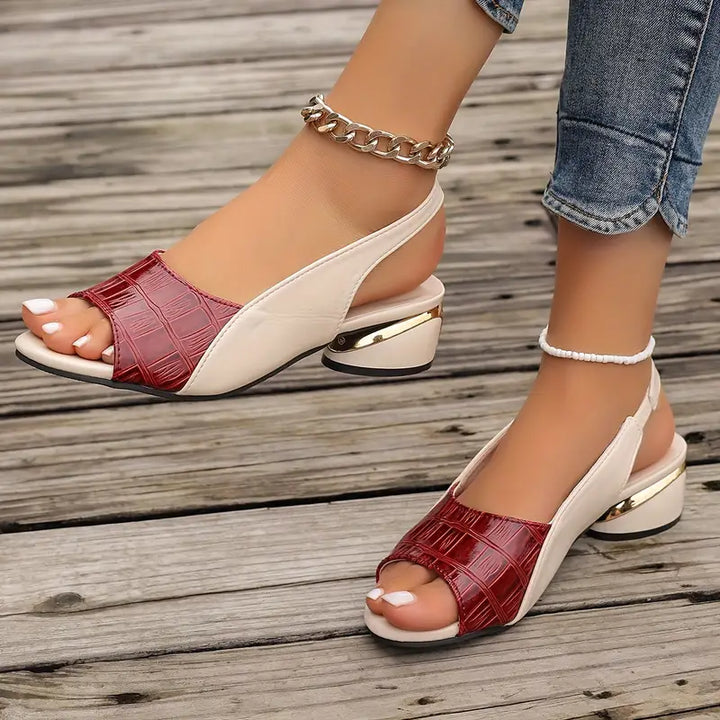 Red and beige sandals on a wooden floor