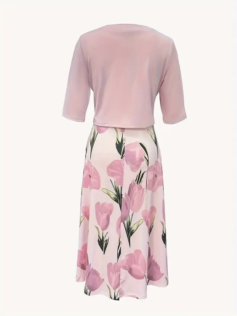 Pink floral dress with a matching top on a white background