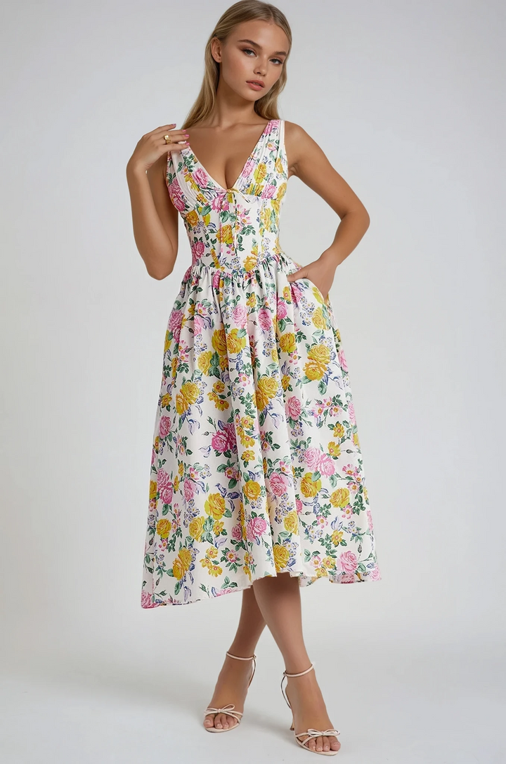 Woman wearing a floral dress on a plain background